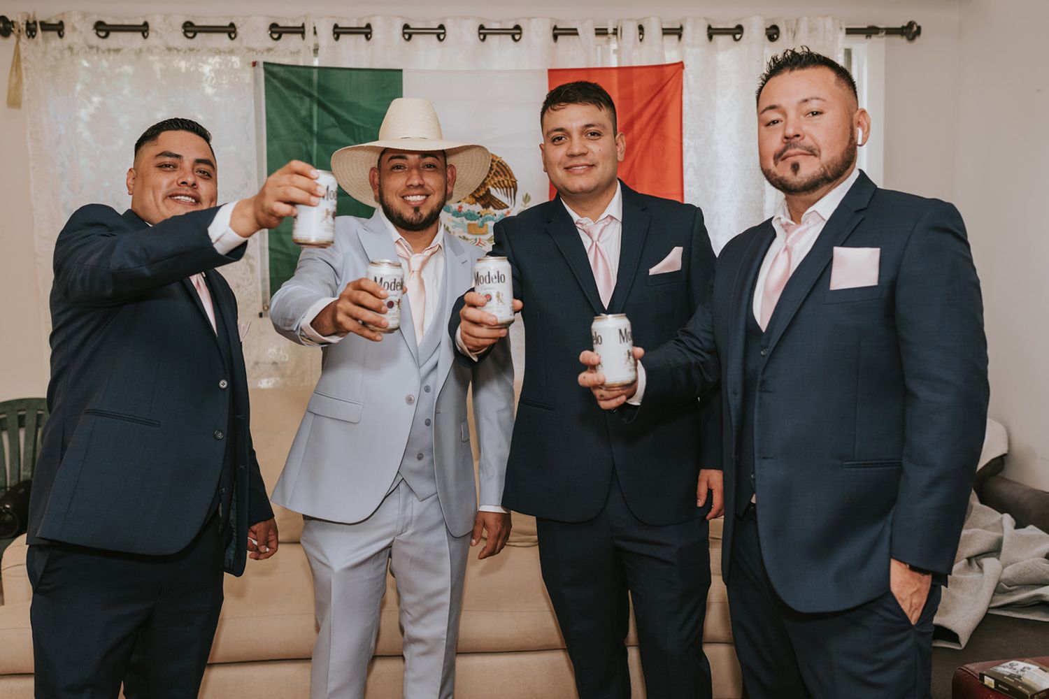 Groom and Groomsmen saying cheers to the camera