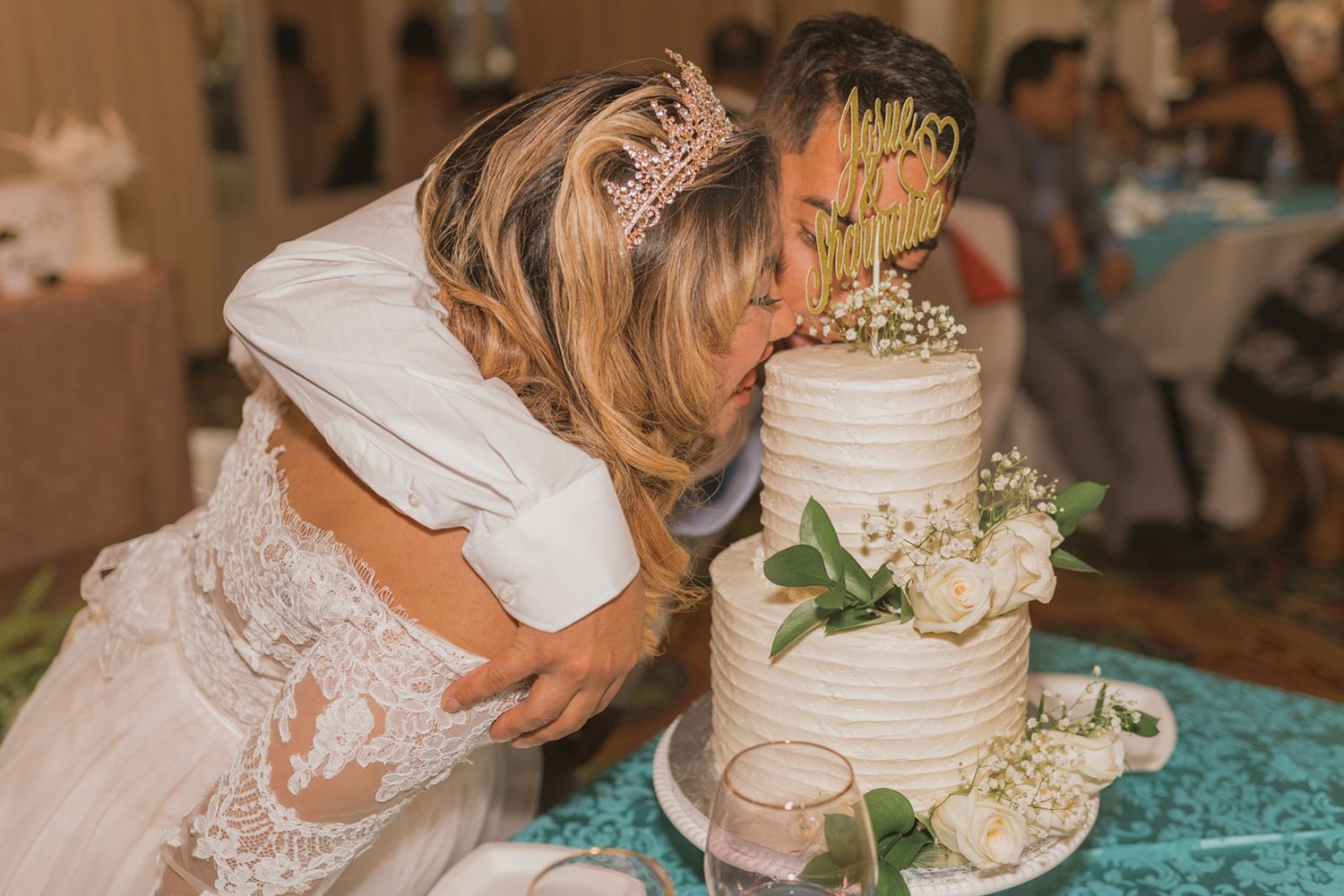 Bride and Groom eats wedding cake with their mouths