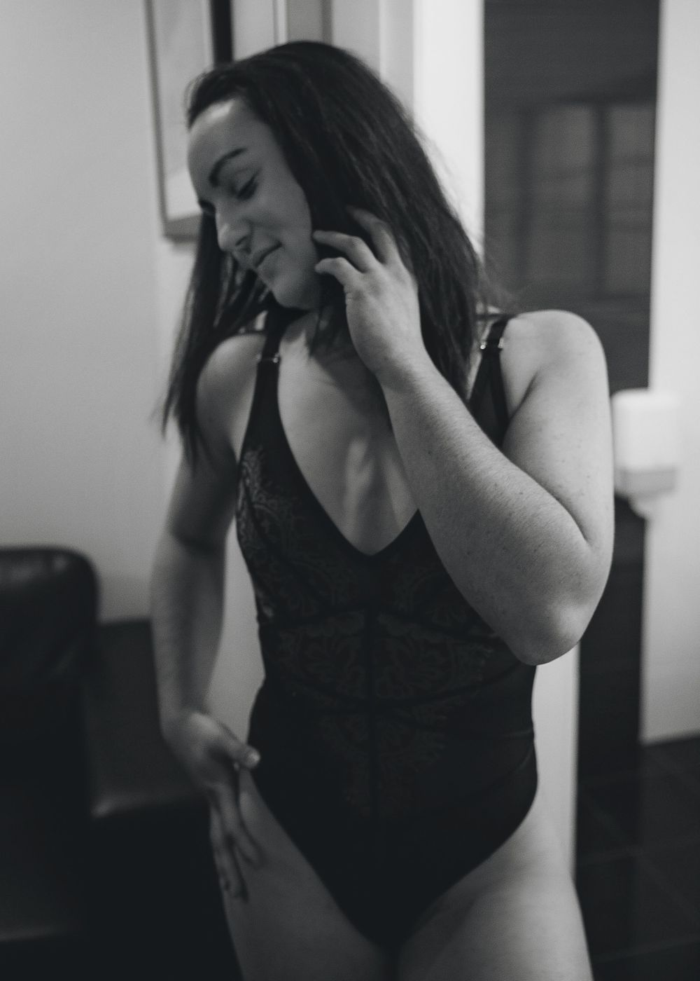 A black and white series of photographs showing someone in a black top expressing different emotional gestures and poses.