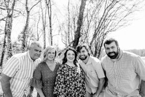 Black and white group photo showing natural interactions outdoors.