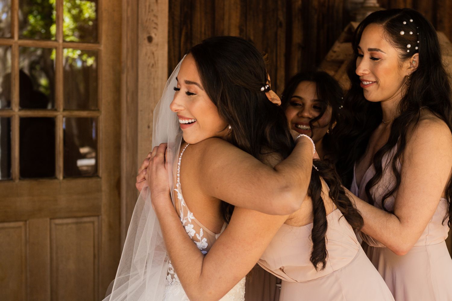 happy hugs with her bridesmaids on her special wedding day