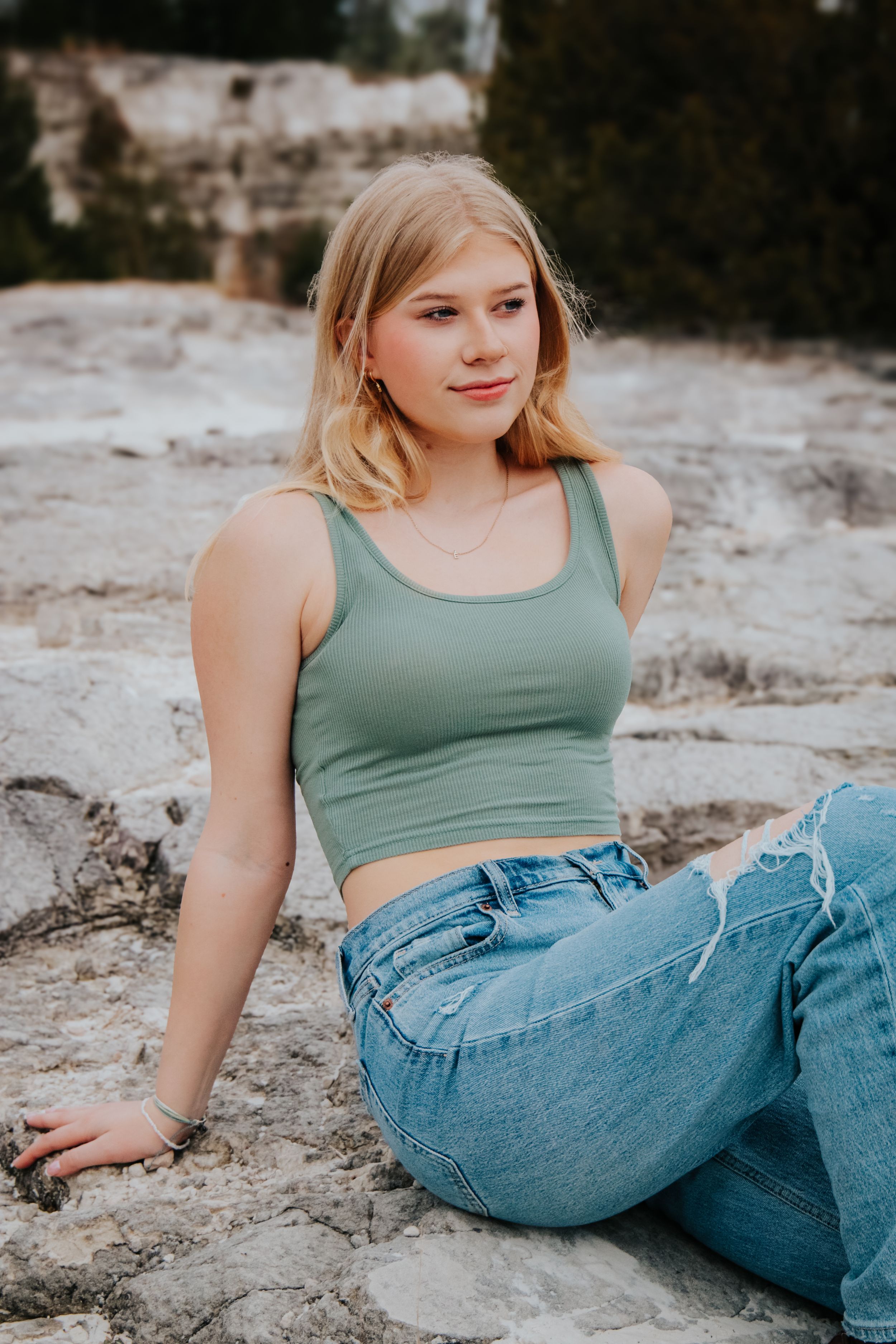 Senior girl on bank of pond