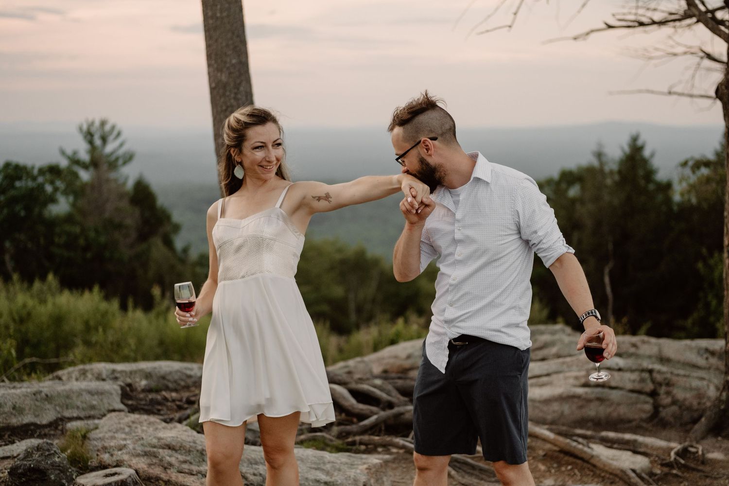 engagement photos with a picnic on the top of a mountain
