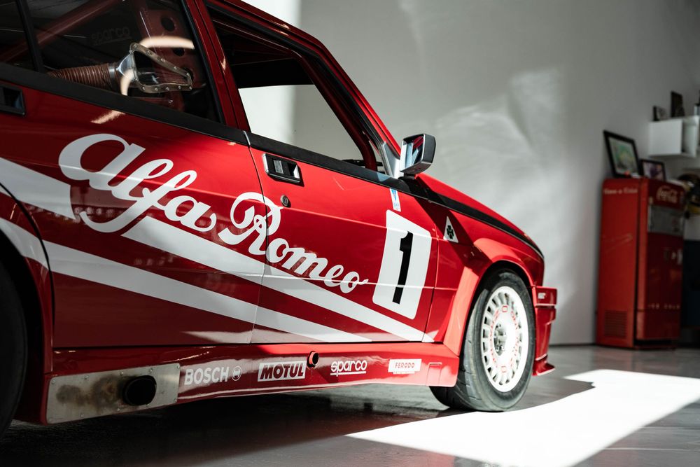 Red Alfa Romeo race trim with shadows