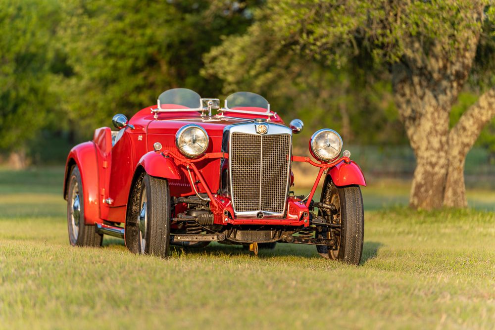 Red MG front view in grass during sunset