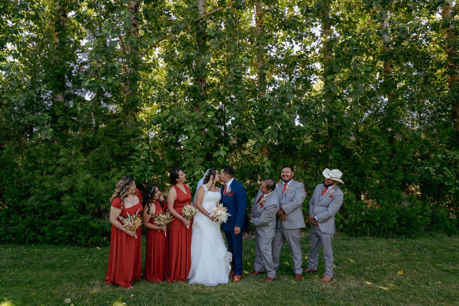Wedding party lined up under trees, casual outdoor Oregon wedding.