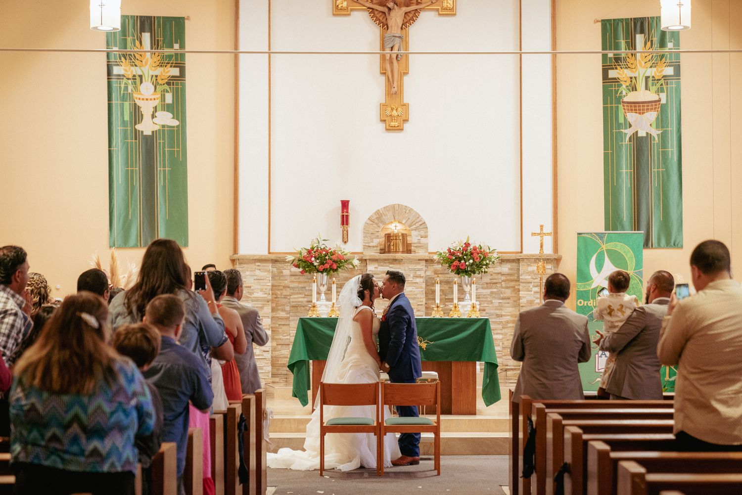 Catholic church ceremony, family gathered for Oregon religious wedding.