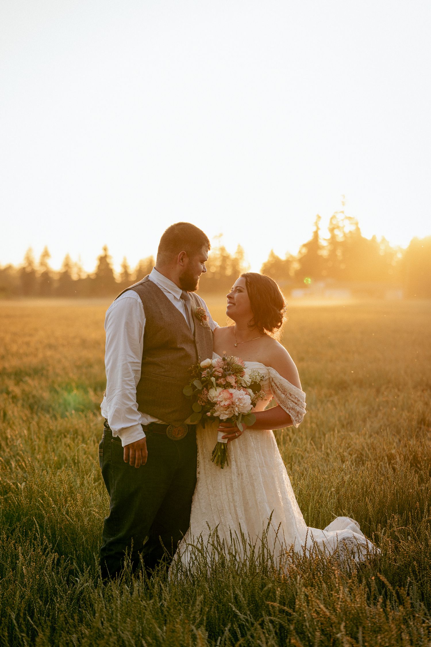 Bride and groom at golden hour in Oregon field, romantic elopement.