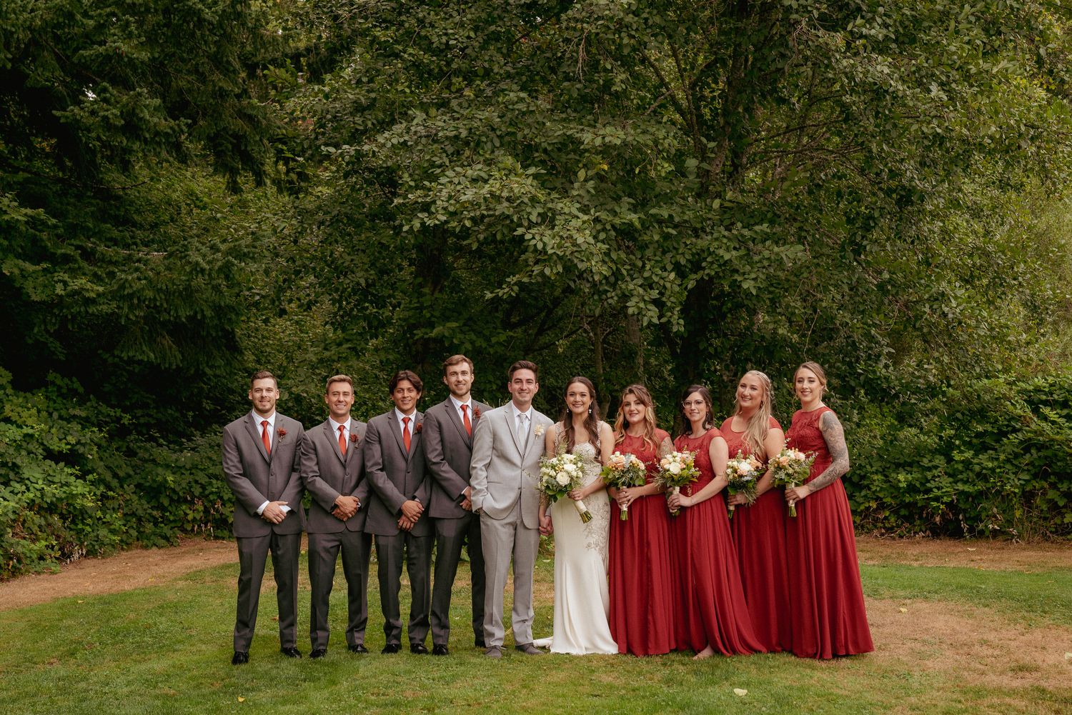 Wedding party in burgundy and gray, classic PNW group portrait.