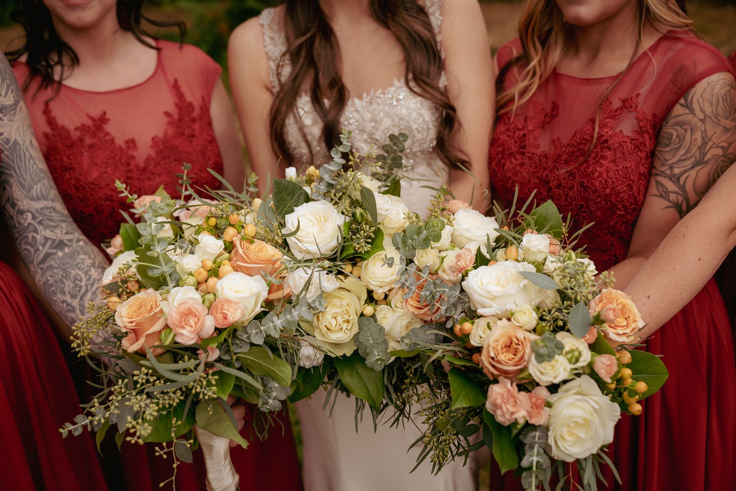Bride holding large blush and peach bouquet, elegant Oregon wedding.