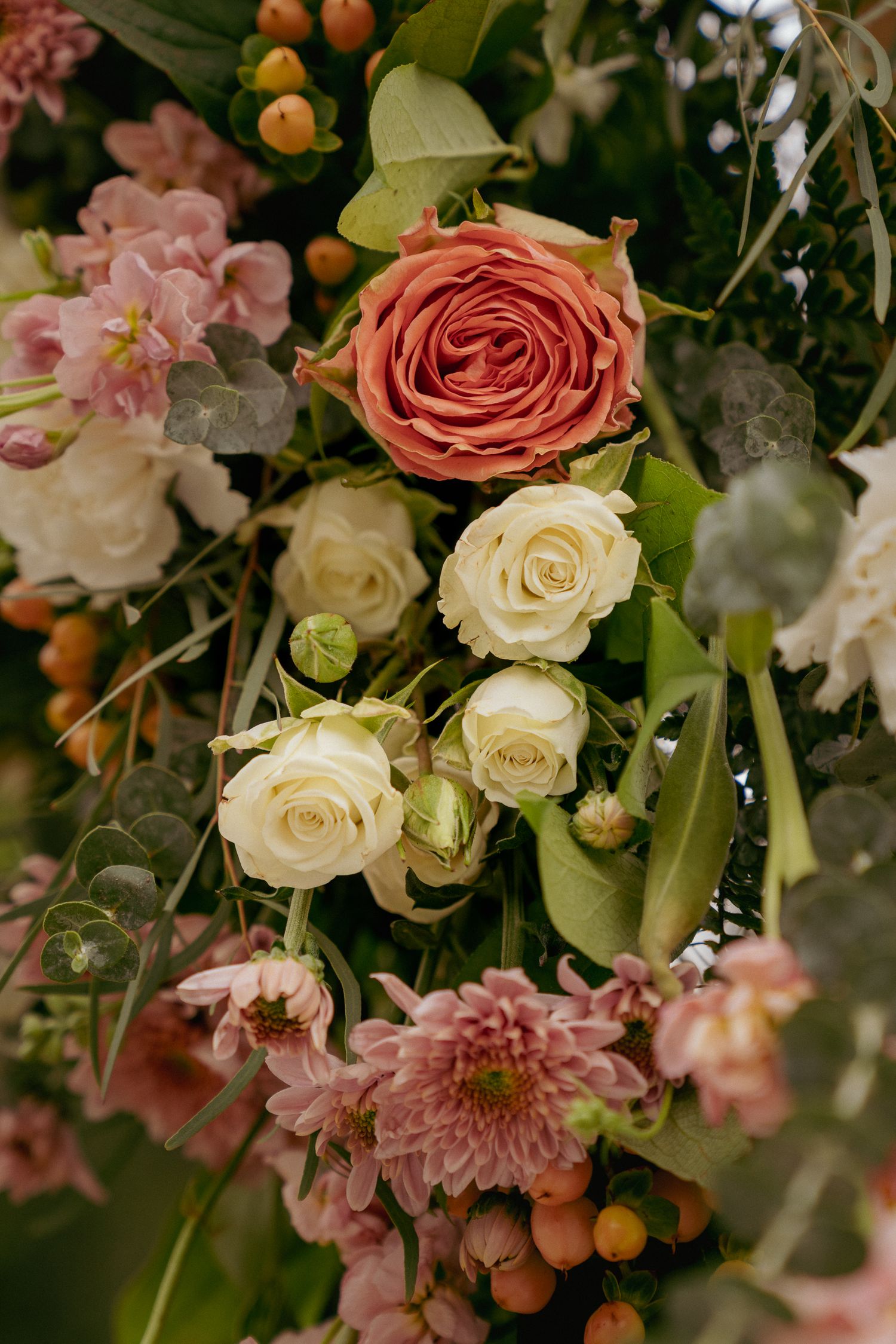 Close-up of blush and white florals, romantic wedding bouquet detail.