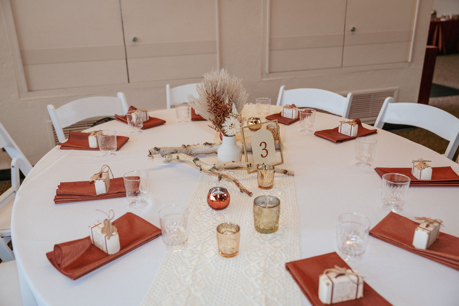 Boho reception table with pampas grass and candles, fall wedding in Oregon.