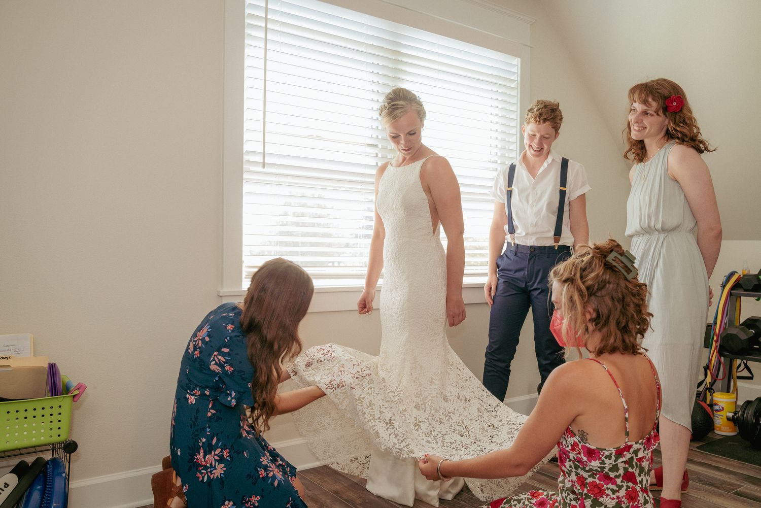 Bride gets help with dress, pre-ceremony getting ready moment in PNW.
