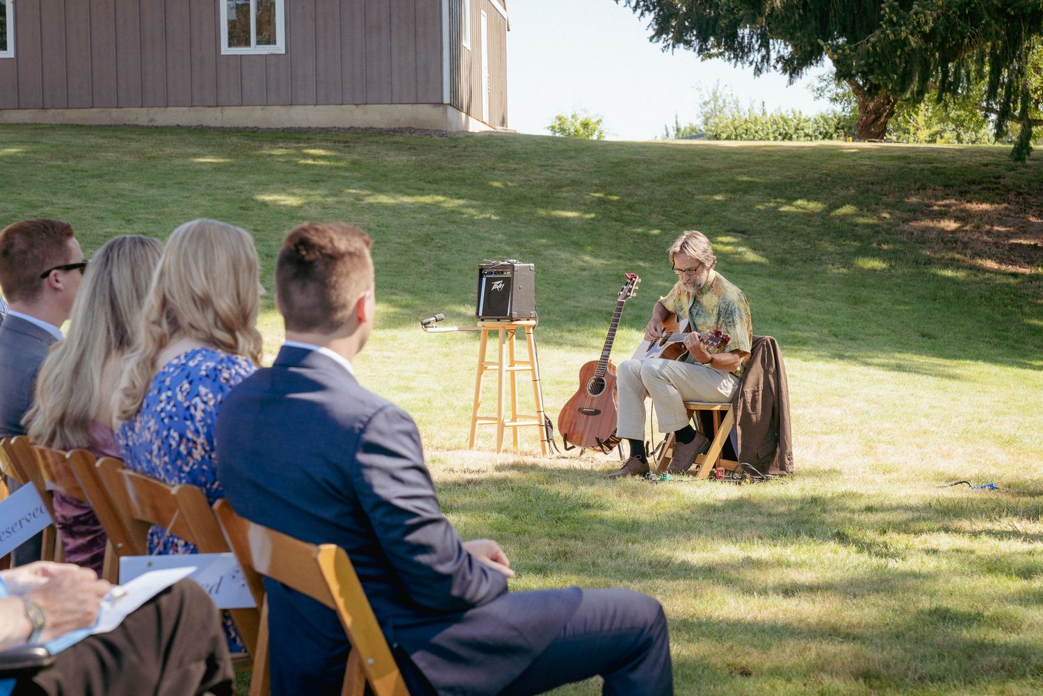 Outdoor wedding with father of the bride playing live guitar for the ceremony, PNW outdoor wedding.