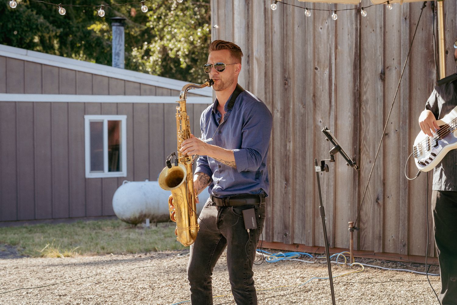 Saxophonist performs during cocktail hour, live PDX wedding vibes.