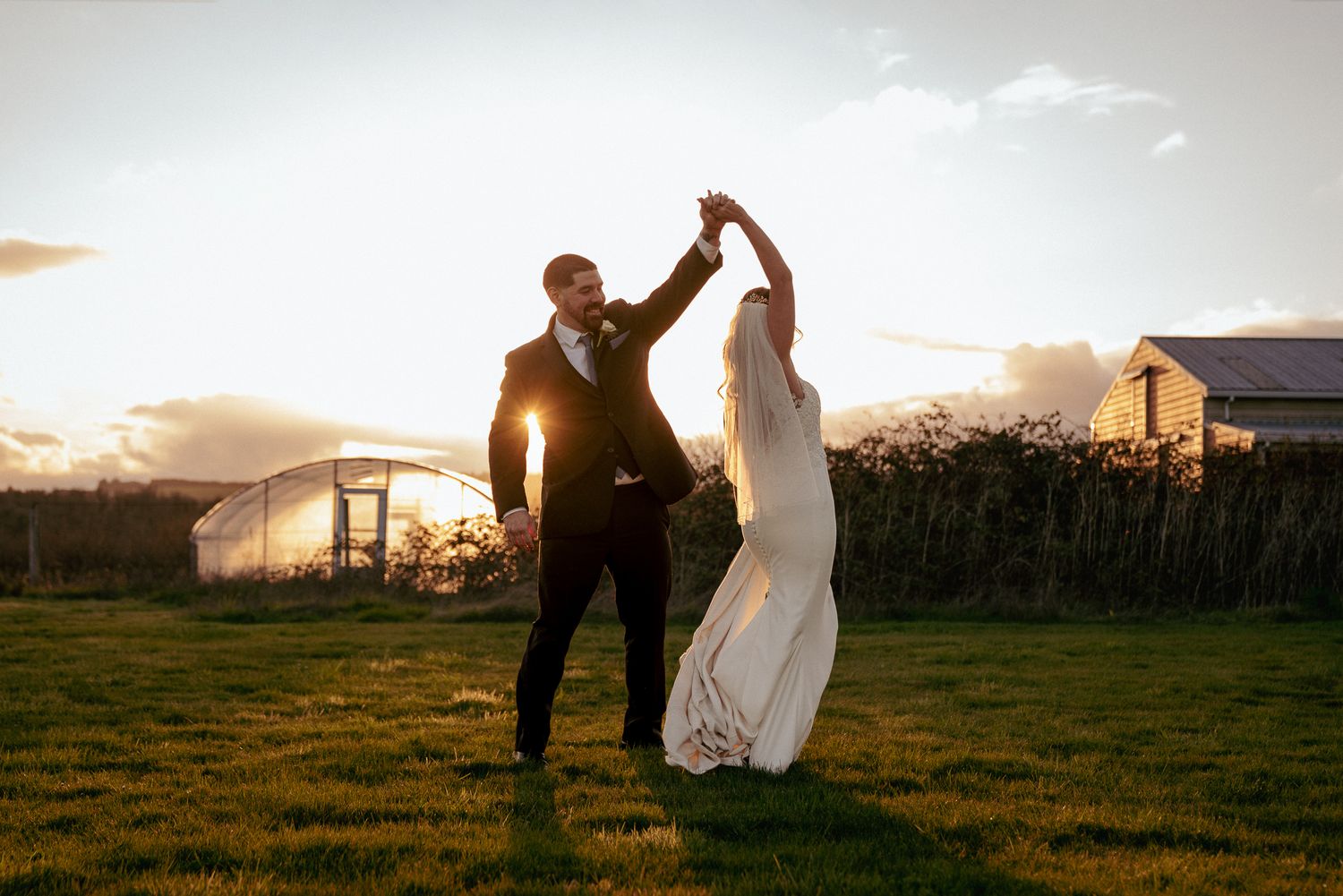 Couple dances at sunset, Oregon countryside wedding magic.