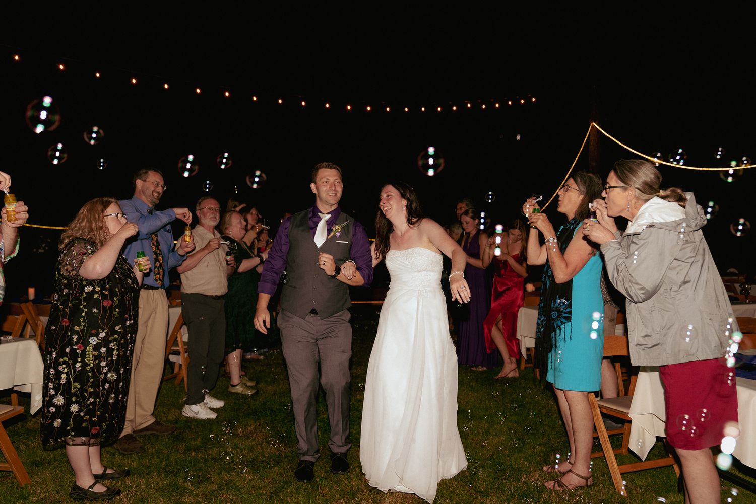 Newlyweds exit under sparklers, PNW night wedding send-off.
