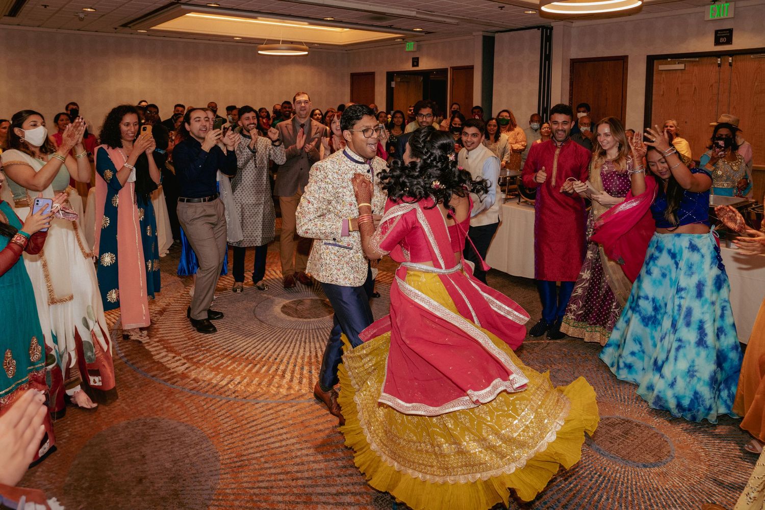 Indian wedding reception with joyful traditional dancing, Portland.