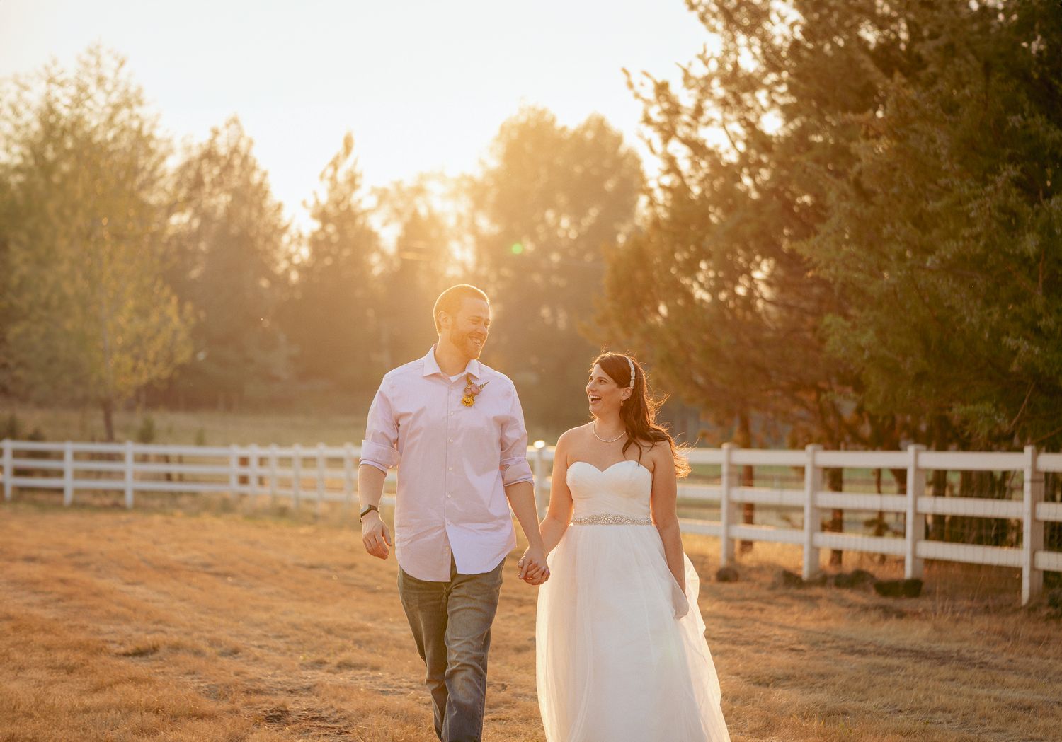 Couple walks hand-in-hand at sunset in Central Oregon.