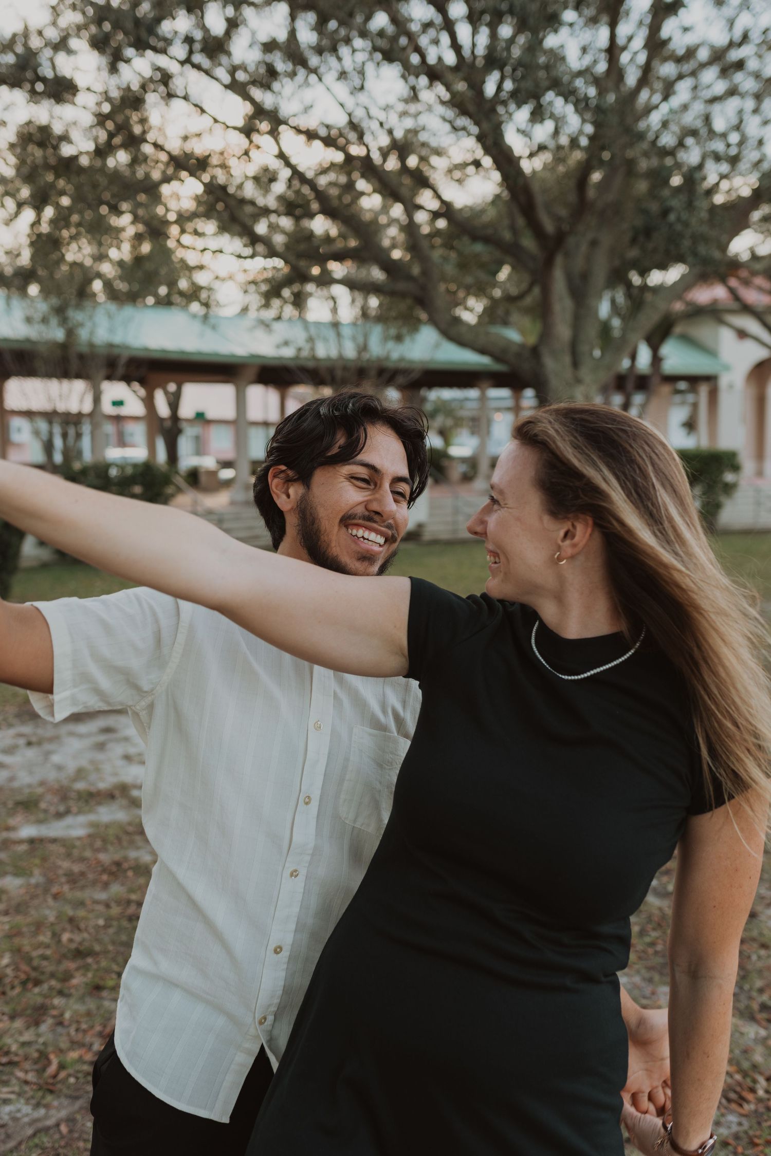 Orlando luxury wedding photographer a happy couple together and celebrating their engagement.