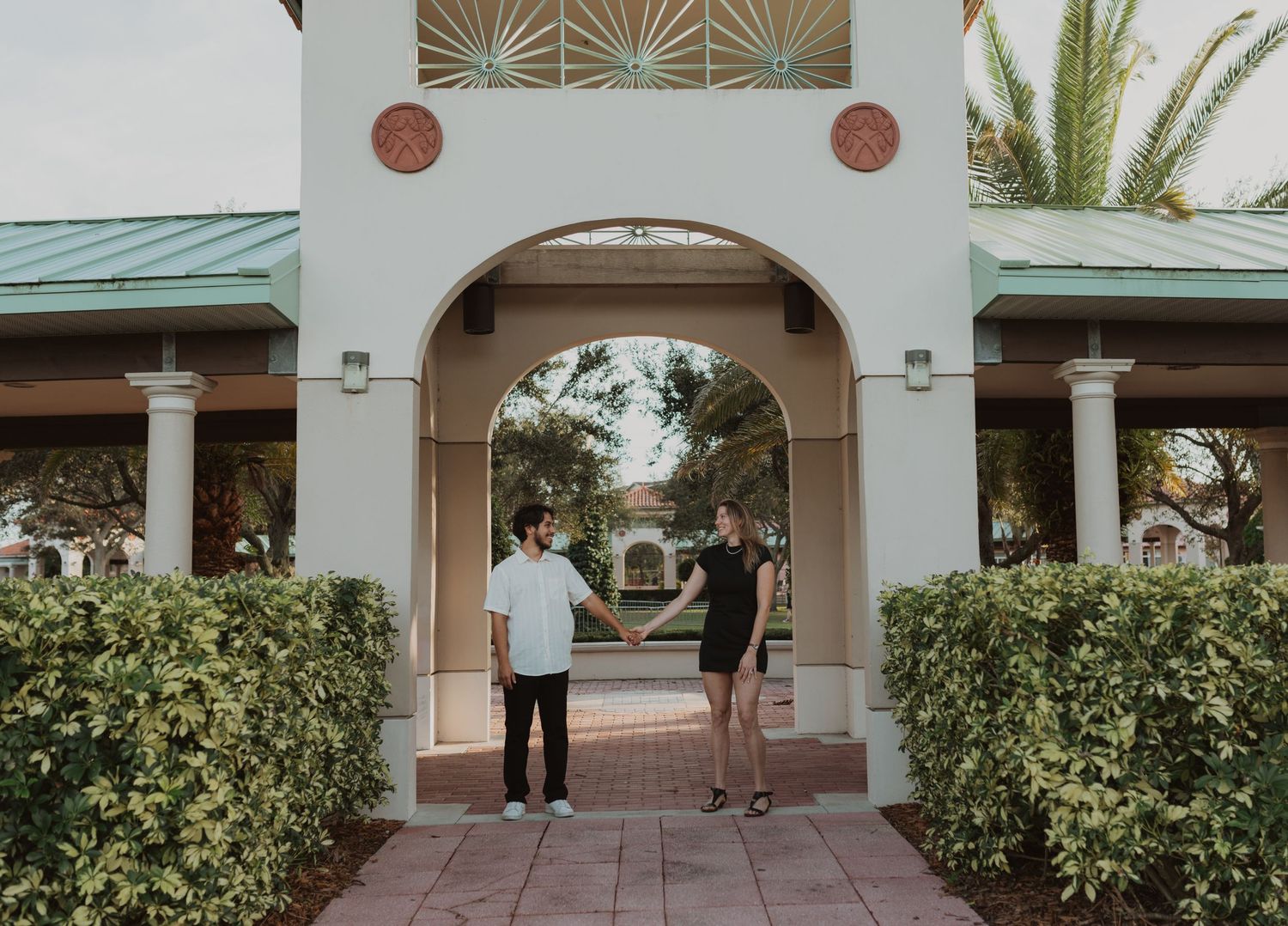 Orlando luxury wedding photographer colonial architecture and palm trees in the background with a couple.