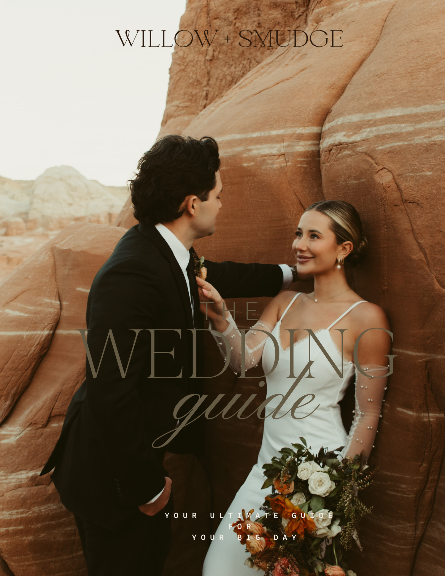 Newlywed couple embraces against stunning red rock canyon walls in a romantic desert wedding photoshoot.