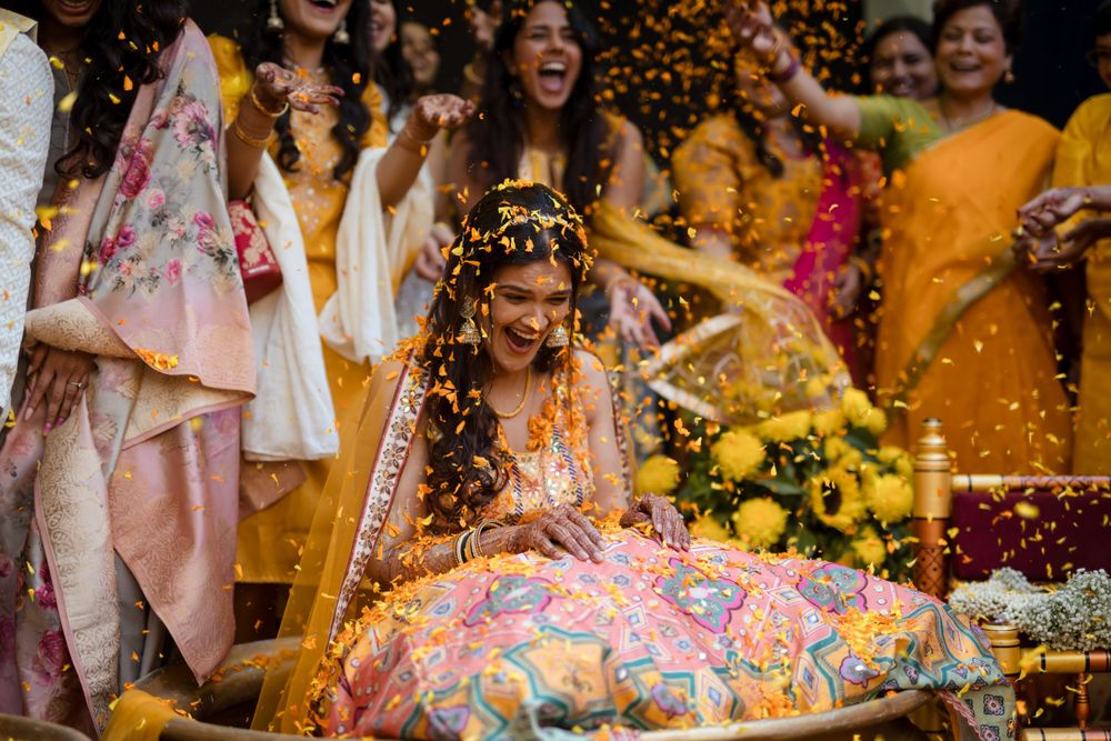 The bride having the best time at her haldi ceremony at Pandit farms, Pune