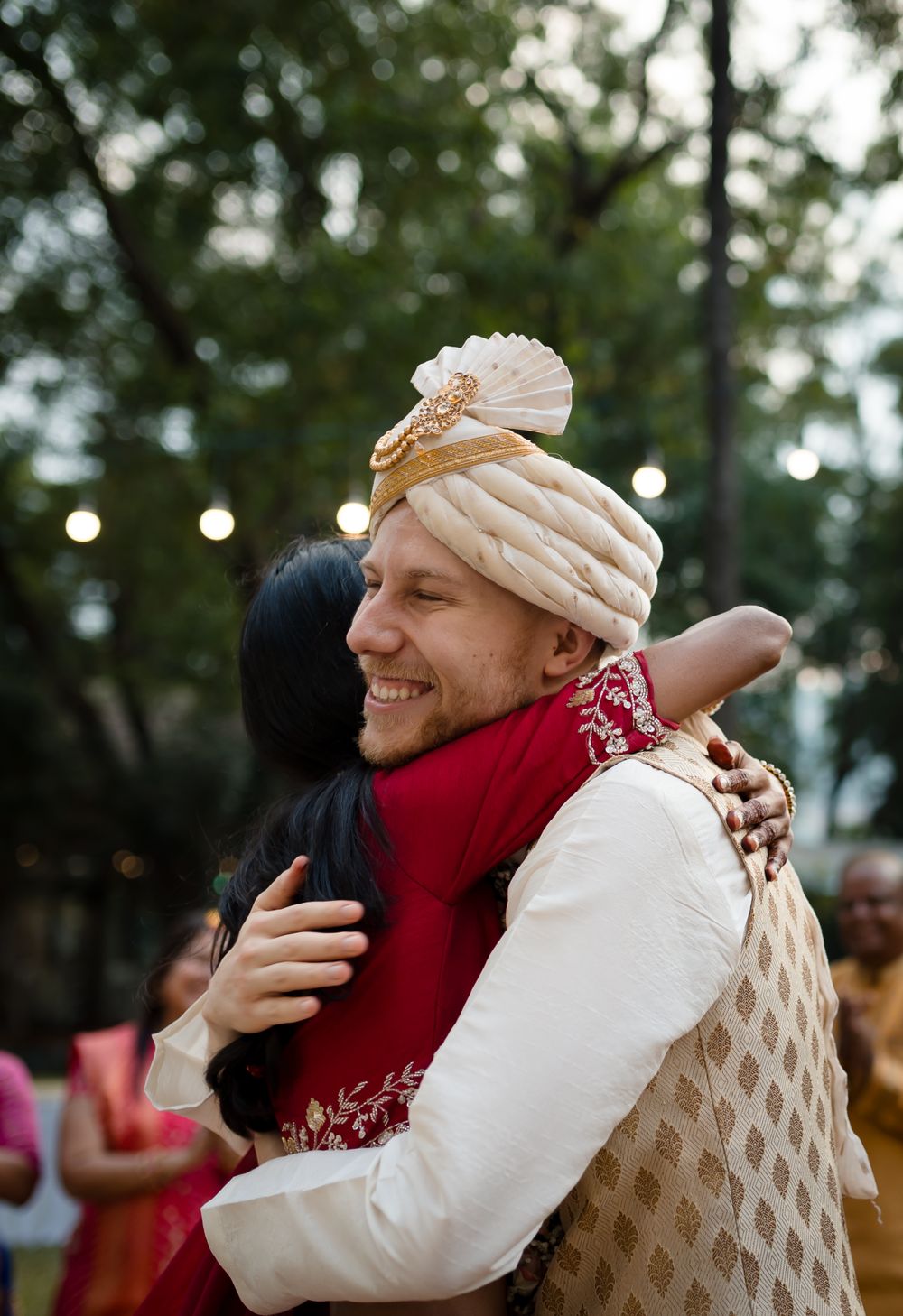 Bride hugging the groom after wedding ceremony at Saffron stays near Pune