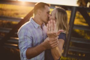 Golden hour engagement session at a scenic waterfront location.
