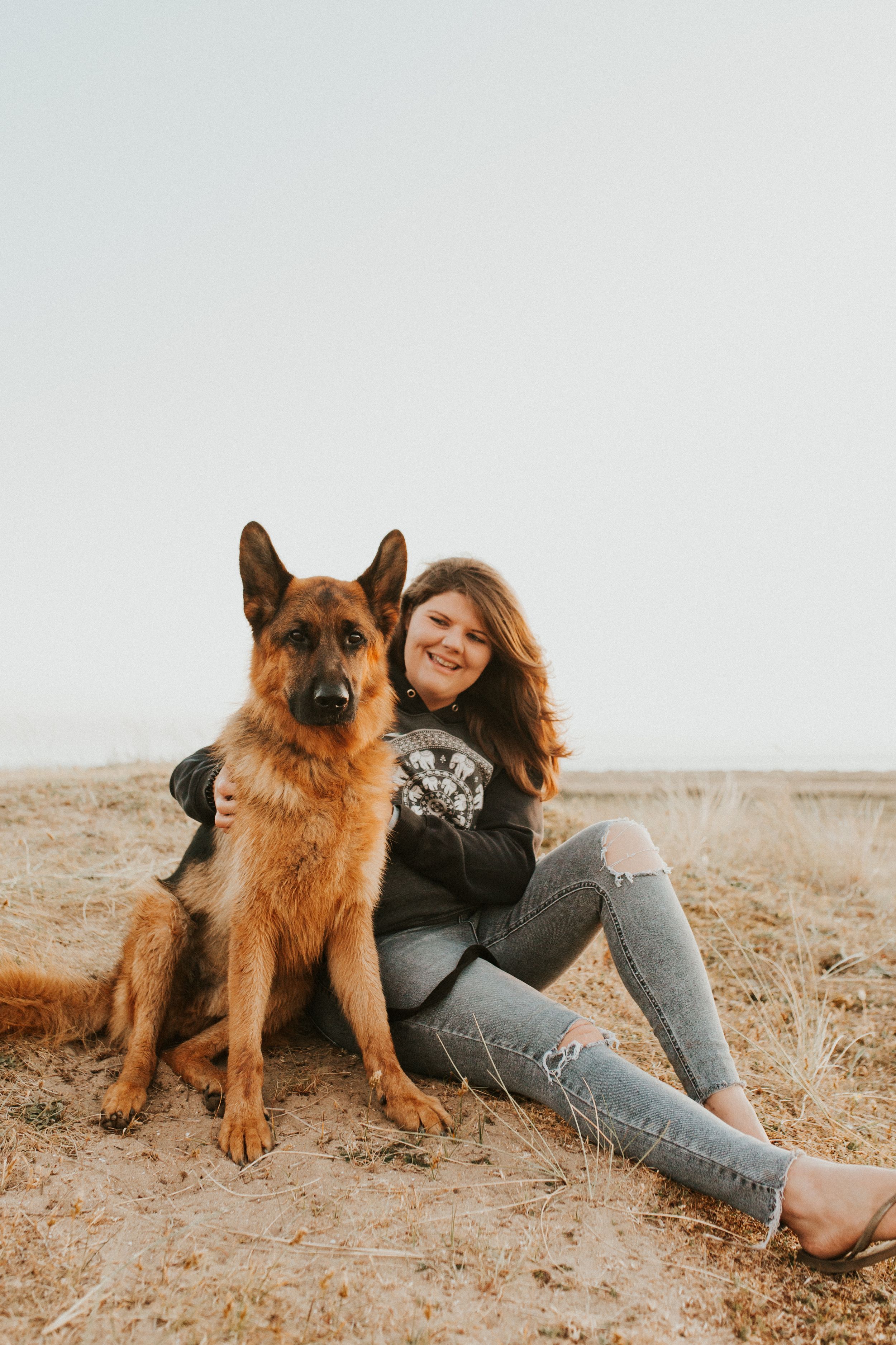 German Shepherd and owner on Norfolk beach