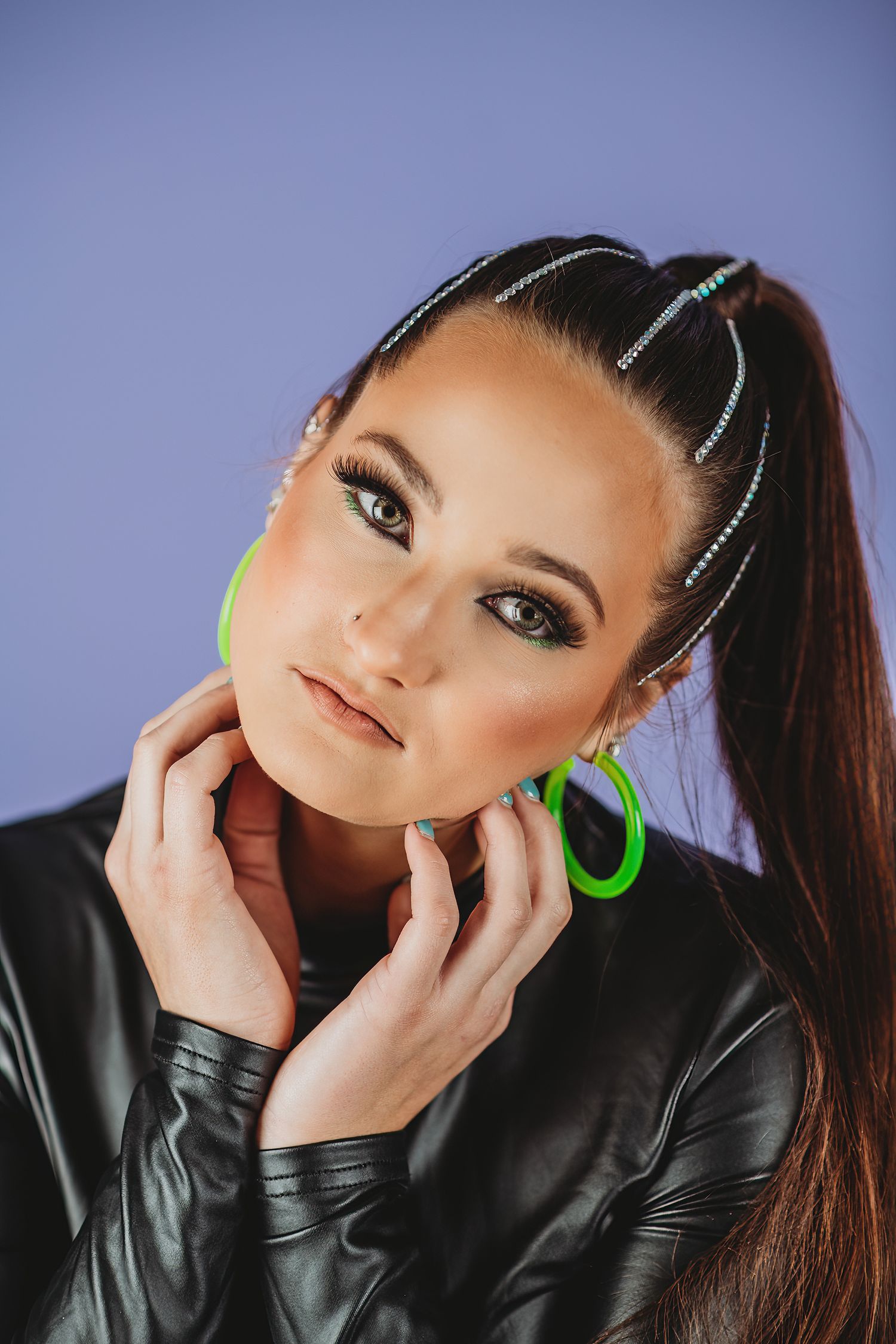 Modern portrait series with sparkly hair clips and neon accessories against purple background.