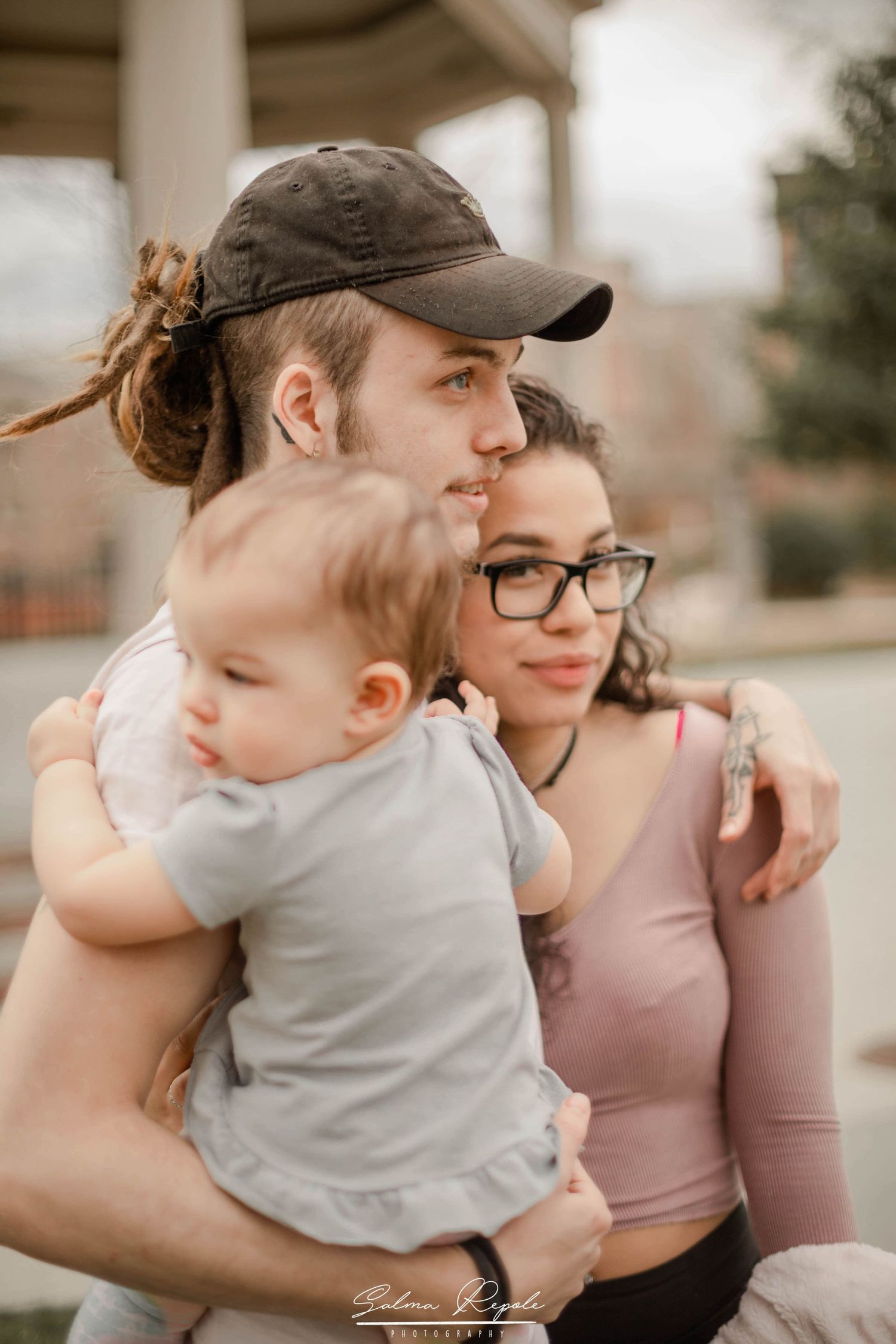 A tender moment captured in soft tones showing affectionate embraces between parent and child.