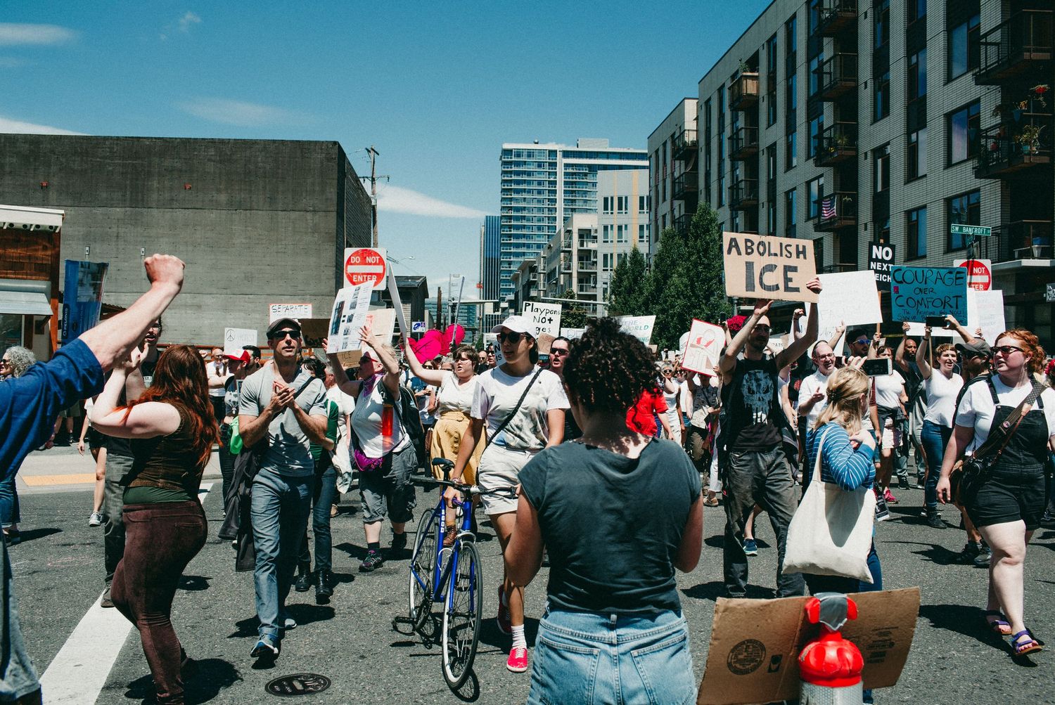 large crowd of protesters march on SW waterfront portland oregon photojournalism