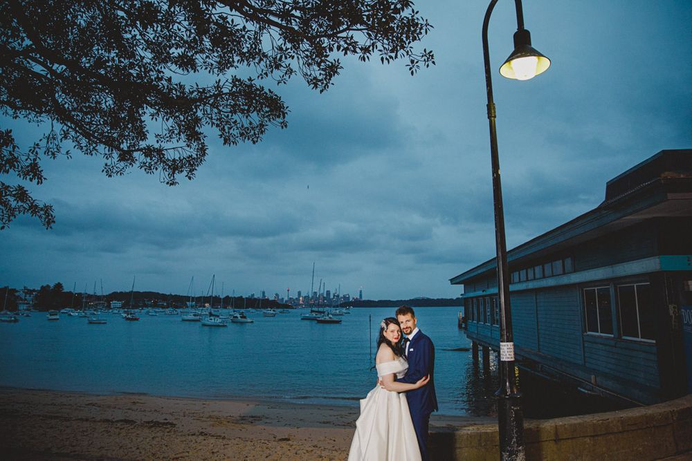 Coastal wedding venue at dusk with ocean views and dramatic blue sky.
