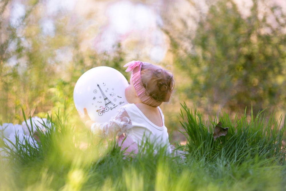 Baby holding a balloon before a cake smash session in Mountain Home, Arkansas
