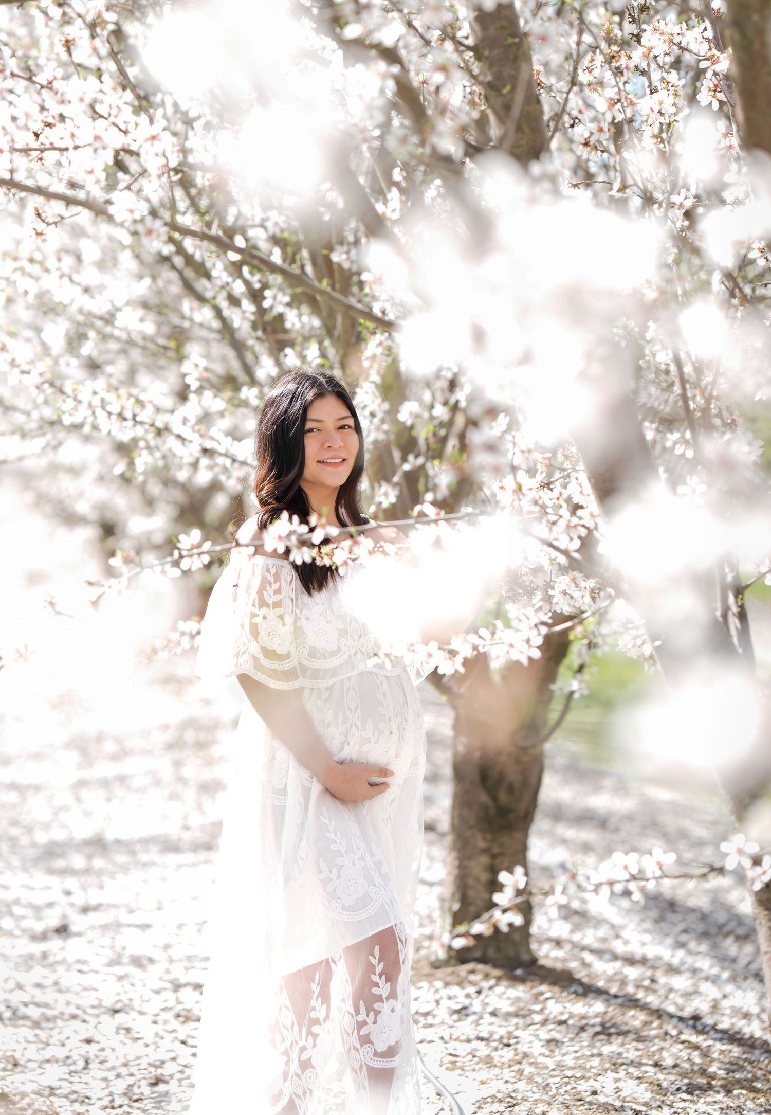 Capture the beauty of pregnancy in the serene and picturesque cherry blossoms with Lilia Chaychenko Photography.