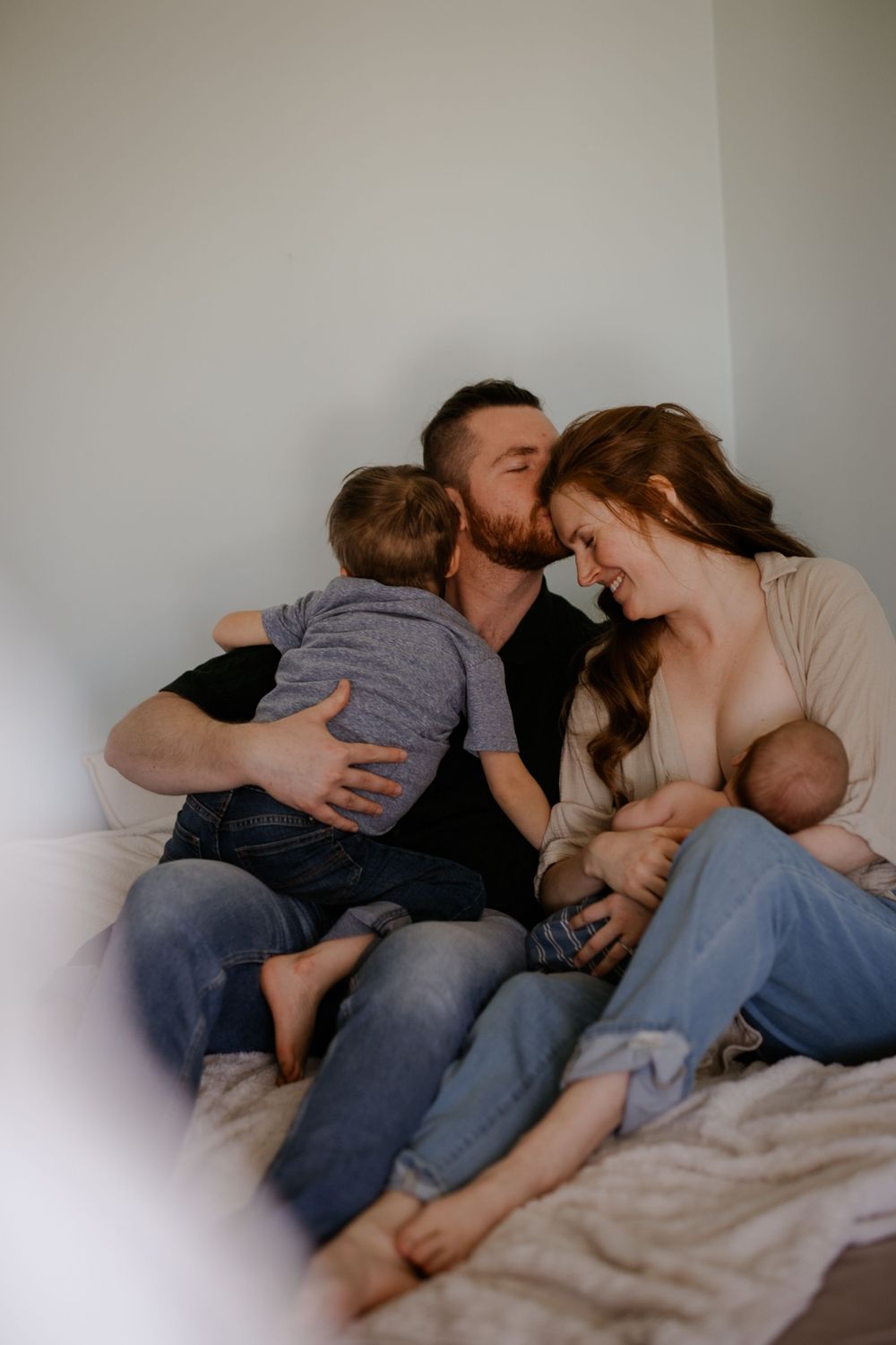 Young family with newborn. Photo by Samantha Bateman.