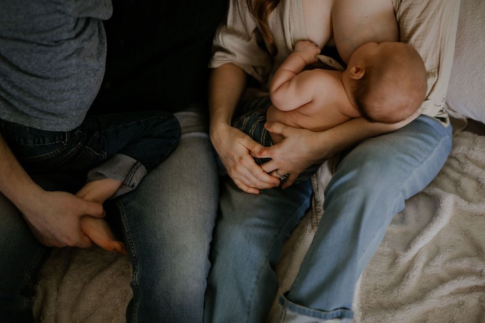 Young family with newborn. Photo by Samantha Bateman.