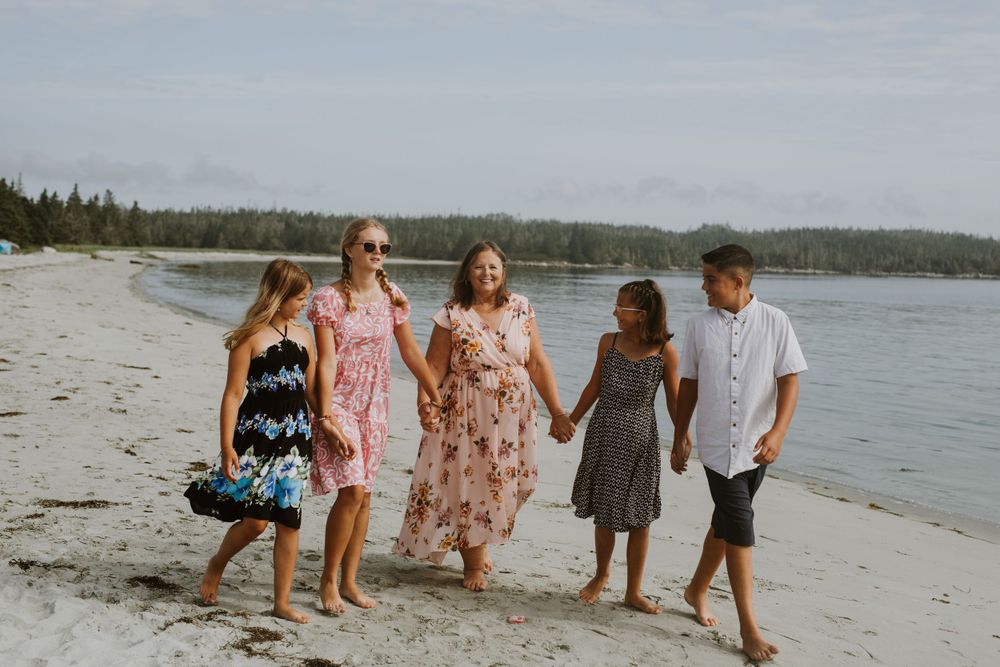 Family walking on beach. Photo by Samantha Bateman.