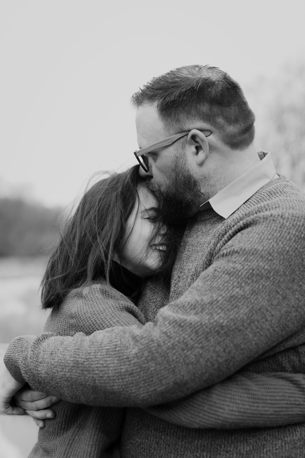 Father hugs teenage child. Photo by Samantha Bateman.
