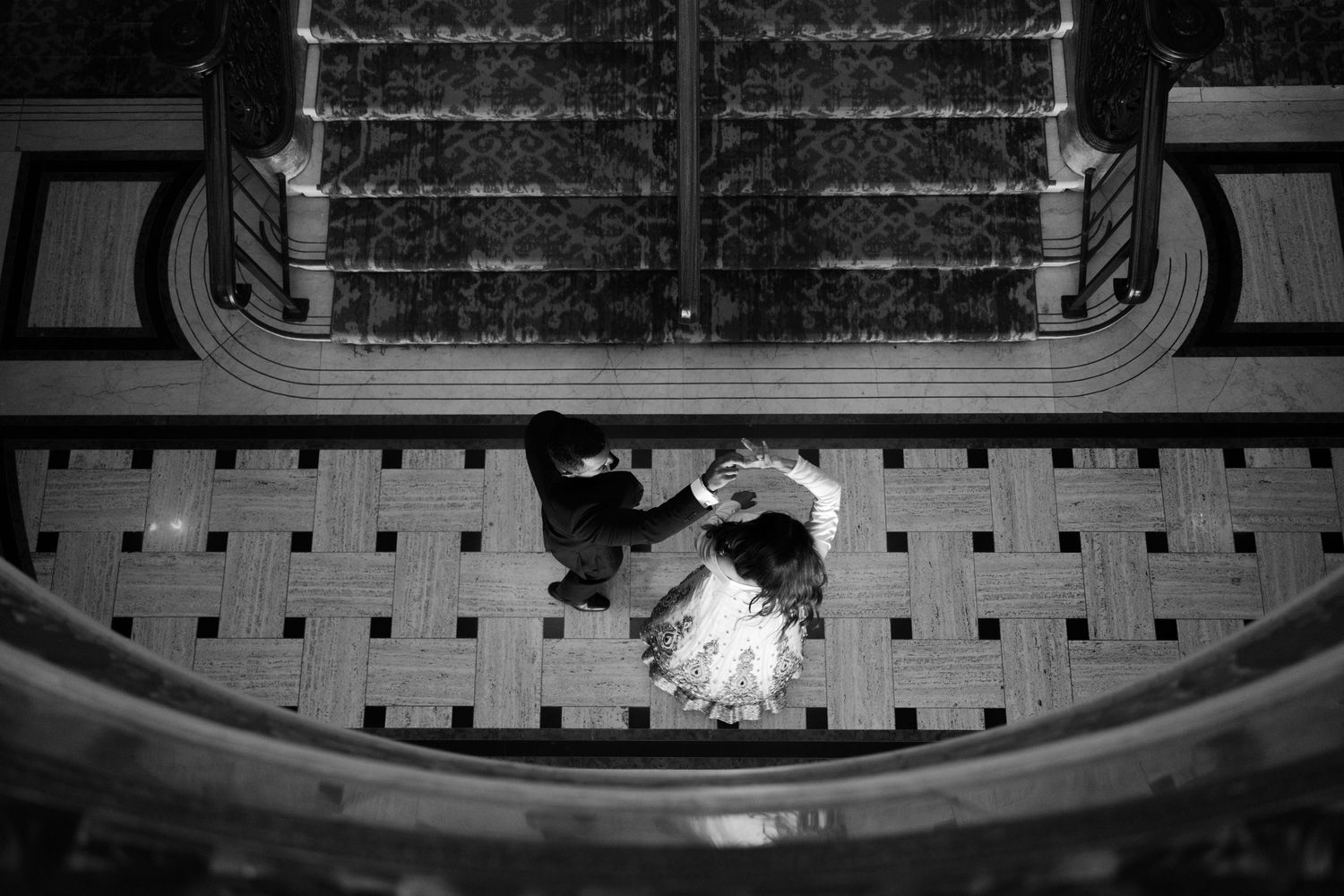 black and white candid photo of couple dancing in the beacon grand hotel in san francisco for engagement photo