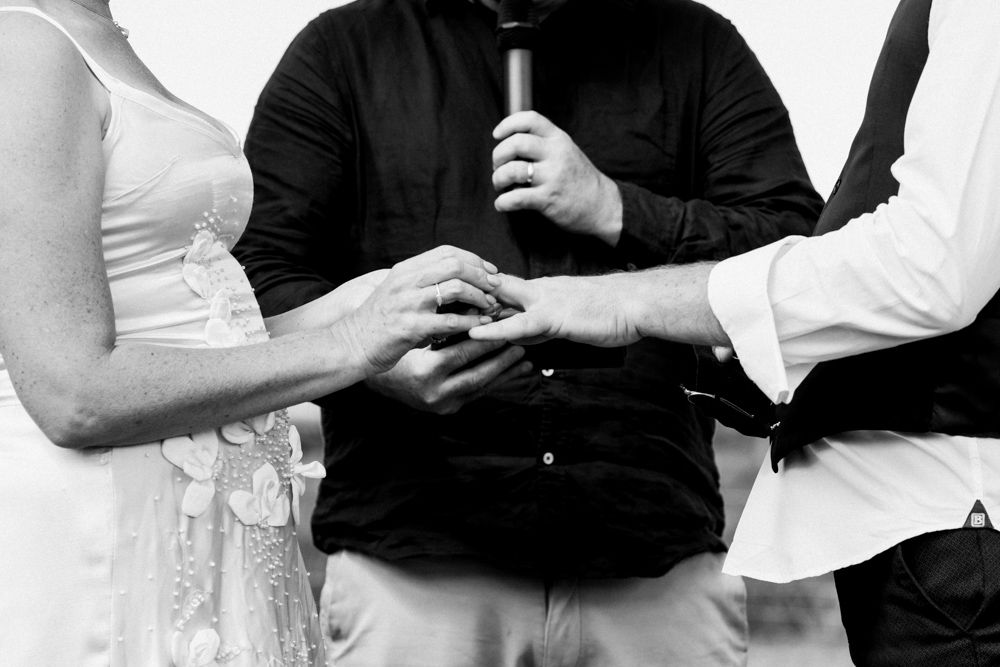 black and white, rings exchange, giving wedding rings, photographers Nelson, Marahau weddings, Abel Tasman elopement