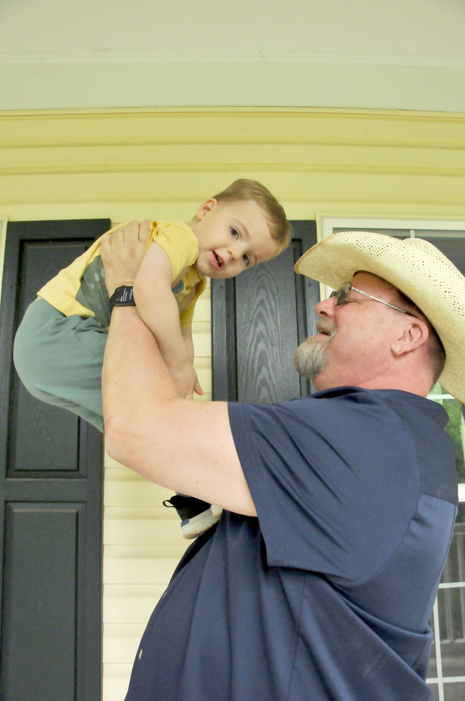 Photo of grandfather with little boy