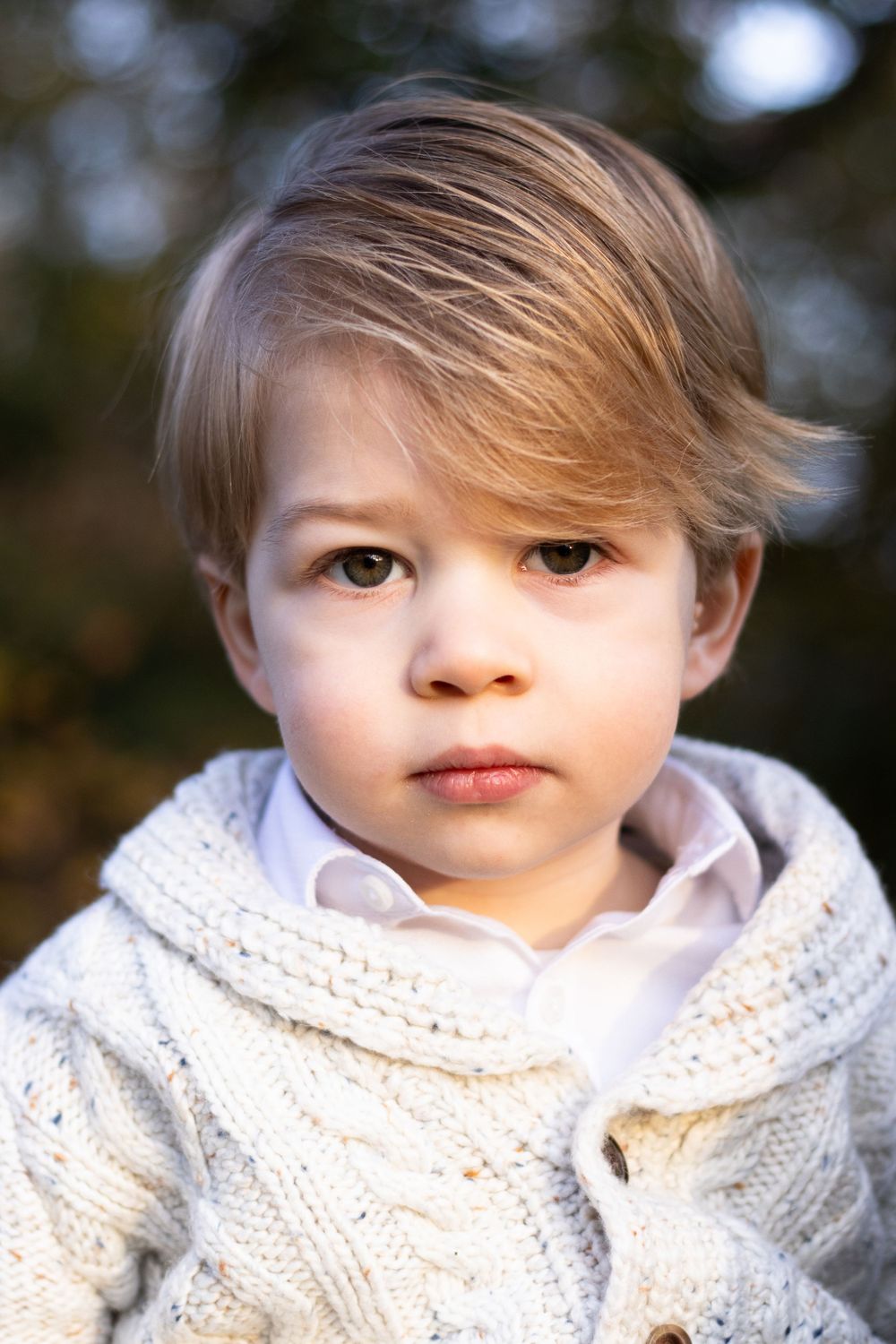 A boy toddler looks into the camera