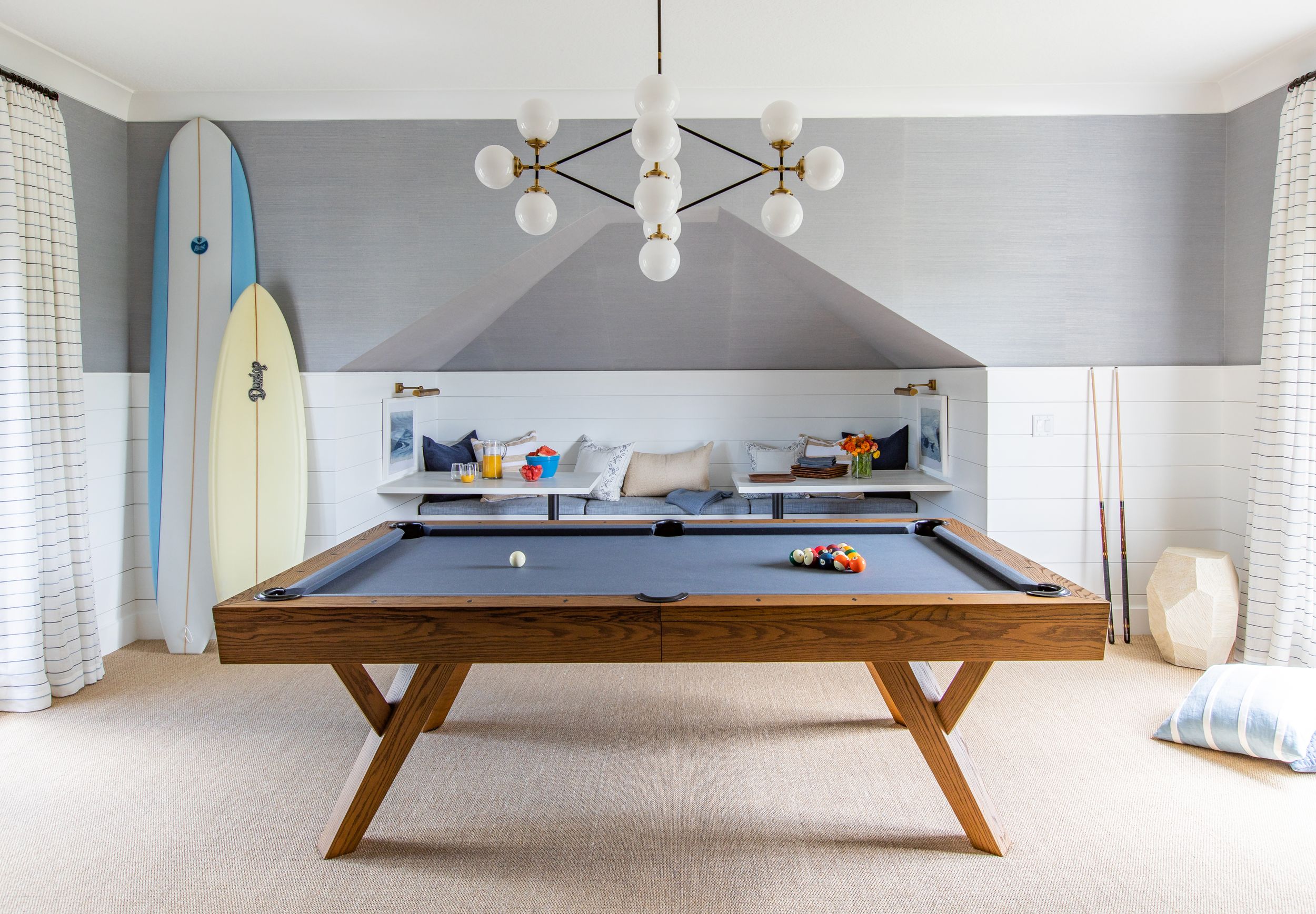 Costal, mid century modern entertainment room designed Orangerie Home.