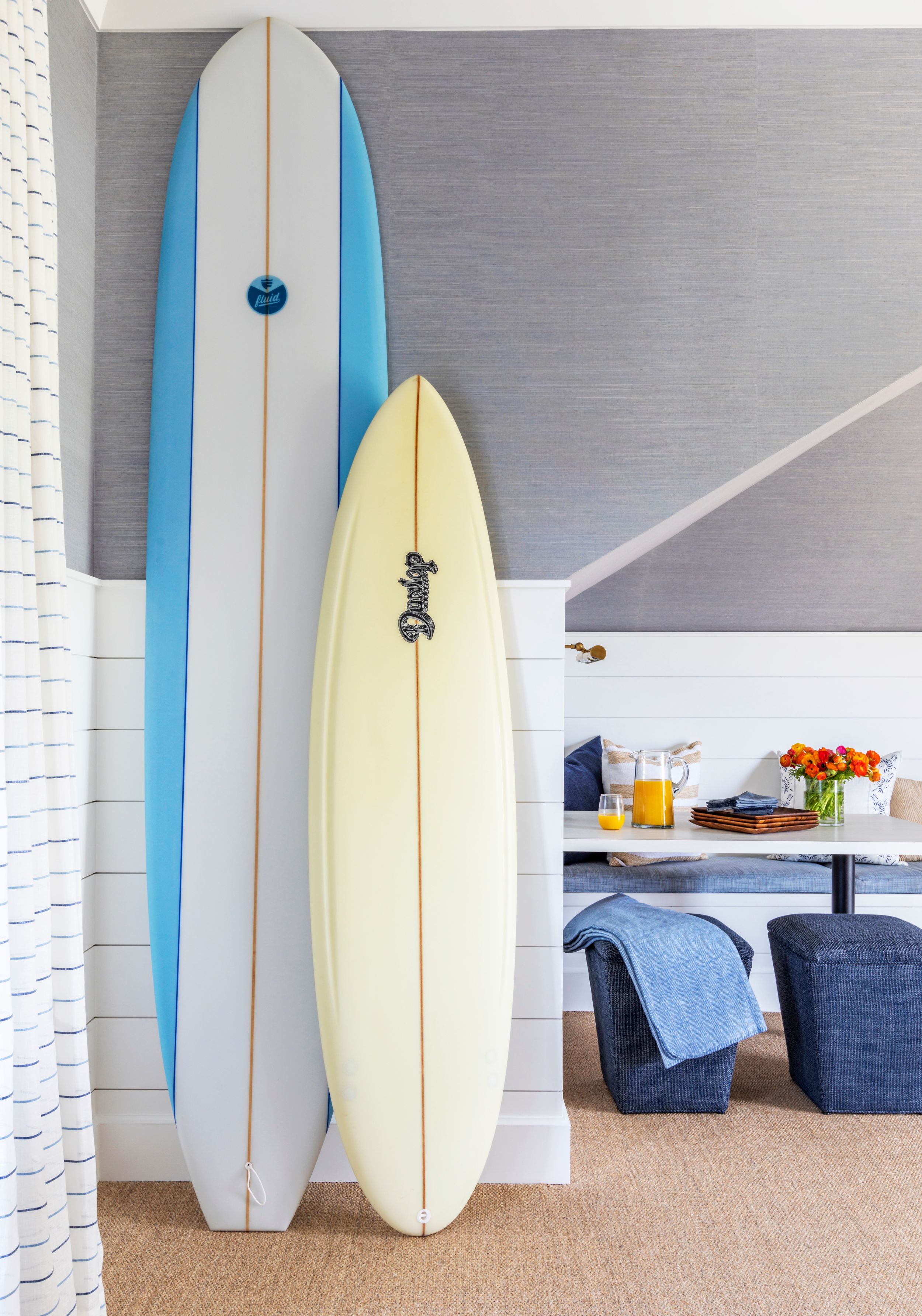 Surf decor in coastal, modern entertainment room.