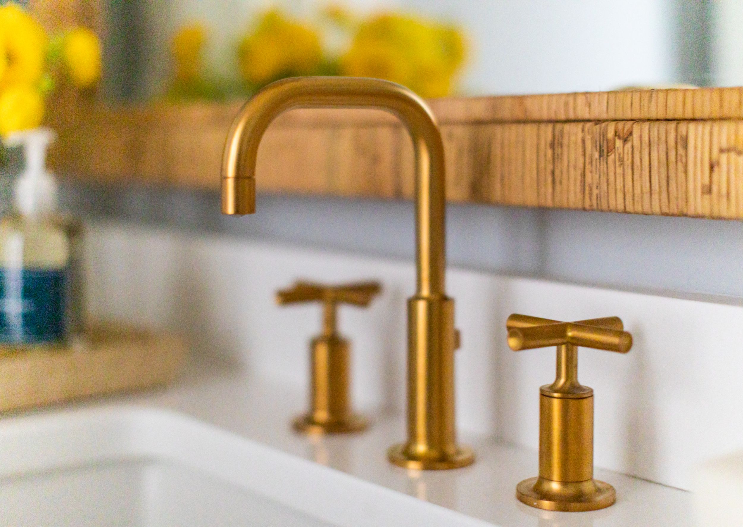 Coastal traditional bathroom with gold hardware