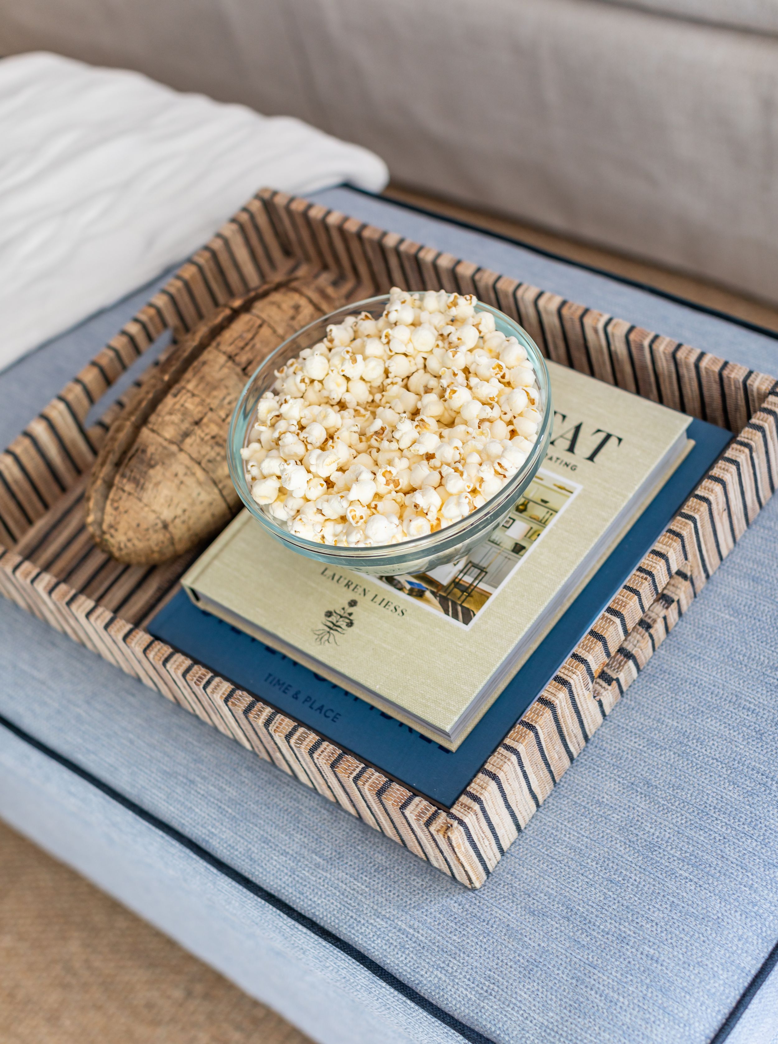 Modern, coastal living room decor on coffee table