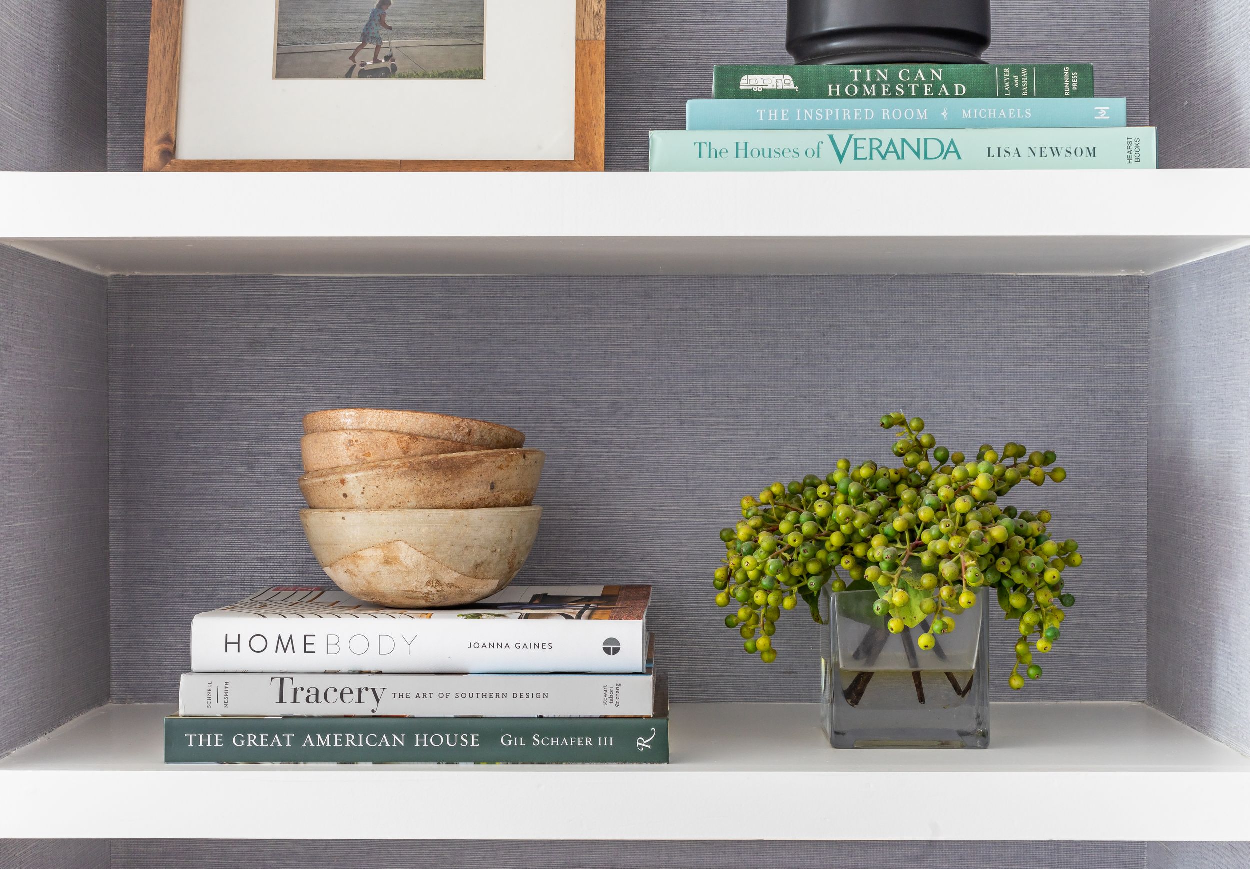 Built in shelving with updated traditional decor.