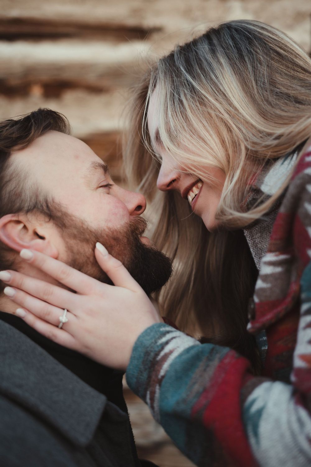 A romantic close-up moment between a couple sharing laughter and tenderness.